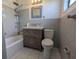 Bathroom featuring a modern vanity, toilet, and shower over tub at 3931 E Eden Roc Cir, Tampa, FL 33634