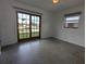 Bedroom with sliding glass doors leading to the outside and a view of the canal at 3931 E Eden Roc Cir, Tampa, FL 33634