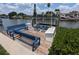 Dock with seating and lift overlooking the serene waterfront at 3931 E Eden Roc Cir, Tampa, FL 33634