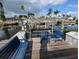 Dock with seating and lift overlooking the tranquil waterfront at 3931 E Eden Roc Cir, Tampa, FL 33634