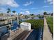Dock with seating and lift overlooking the waterfront at 3931 E Eden Roc Cir, Tampa, FL 33634