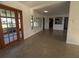 Bright living room with large windows and view of the backyard and patio at 3931 E Eden Roc Cir, Tampa, FL 33634