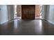 Bright living room featuring polished floors, double doors and large windows at 3931 E Eden Roc Cir, Tampa, FL 33634