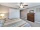 Comfortable bedroom with a dresser, closet, and ceiling fan at 10957 Keys Gate Dr, Riverview, FL 33579