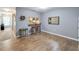 Open concept dining area with hardwood floors and kitchen view at 10957 Keys Gate Dr, Riverview, FL 33579