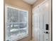 Bright entryway with a white door and window with blinds at 10957 Keys Gate Dr, Riverview, FL 33579