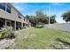 Grass backyard area with a privacy wall at 10957 Keys Gate Dr, Riverview, FL 33579