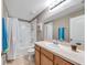 Bathroom with tub, shower, and wood vanity at 10957 Keys Gate Dr, Riverview, FL 33579