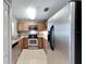 Modern kitchen with stainless steel appliances and granite countertops at 10957 Keys Gate Dr, Riverview, FL 33579
