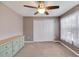 Spacious bedroom featuring a ceiling fan and ample closet space at 10957 Keys Gate Dr, Riverview, FL 33579
