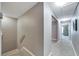 Upstairs hallway with carpet and doors to bedrooms at 10957 Keys Gate Dr, Riverview, FL 33579