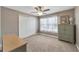 Well-lit bedroom with double doors and carpeted floor at 10957 Keys Gate Dr, Riverview, FL 33579
