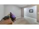 Spacious basement room with desk and gaming chair at 10957 Keys Gate Dr, Riverview, FL 33579
