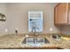 Double stainless steel sink with granite countertop in this kitchen at 10957 Keys Gate Dr, Riverview, FL 33579