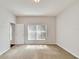 Spacious bedroom with carpet and large window at 803 Parsons Pointe St, Seffner, FL 33584