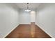 Spacious dining room featuring hardwood floors and an arched doorway at 803 Parsons Pointe St, Seffner, FL 33584
