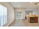 Kitchen breakfast nook with backyard access and wood-look floors at 803 Parsons Pointe St, Seffner, FL 33584