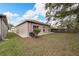 Back of house showing a large grassy yard with a patio at 803 Parsons Pointe St, Seffner, FL 33584