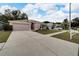 One-story house with a two-car garage and neatly landscaped front yard at 803 Parsons Pointe St, Seffner, FL 33584