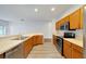 Modern kitchen with stainless steel appliances and light wood cabinets at 803 Parsons Pointe St, Seffner, FL 33584