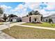 One-story house with a two-car garage and a well-manicured lawn at 803 Parsons Pointe St, Seffner, FL 33584