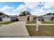 One-story house with a two-car garage and landscaped lawn at 803 Parsons Pointe St, Seffner, FL 33584