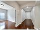 Bright hallway with hardwood floors and neutral walls at 803 Parsons Pointe St, Seffner, FL 33584