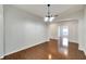 Bright dining room with hardwood floors and a chandelier at 803 Parsons Pointe St, Seffner, FL 33584