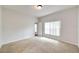 Bright bedroom featuring carpet flooring and a window at 803 Parsons Pointe St, Seffner, FL 33584