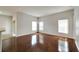 Bright living room with hardwood floors and large windows at 803 Parsons Pointe St, Seffner, FL 33584