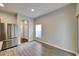 Bright breakfast nook with wood-look flooring and access to the backyard at 803 Parsons Pointe St, Seffner, FL 33584