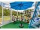 Peaceful sunroom with a swing, seating, and a view of the backyard at 2128 W Del Webb Blvd, Sun City Center, FL 33573