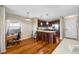 Eat-in kitchen with hardwood floors and an island at 5712 Biscayne Ct # 105, New Port Richey, FL 34652