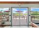 Deck overlooking a peaceful lake with seating for relaxation at 17501 Brown Rd, Odessa, FL 33556