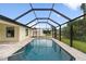 Relaxing screened-in pool with a spacious deck at 9187 Prospect Ave, Englewood, FL 34224
