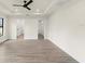 Spacious bedroom with large window, walk-in closet, and wood-look flooring at 9187 Prospect Ave, Englewood, FL 34224