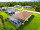 Aerial view of a house with a pool and a screened enclosure at 9187 Prospect Ave, Englewood, FL 34224