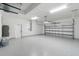 Finished garage featuring epoxy flooring and an open layout at 9187 Prospect Ave, Englewood, FL 34224