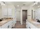 Bathroom with granite countertops, double sinks, and walk-in shower at 9187 Prospect Ave, Englewood, FL 34224