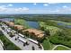 Aerial view of condo community with golf course views at 8403 Grand Estuary Trl # 106, Bradenton, FL 34212