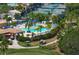 Community pool and clubhouse with lush landscaping at 8403 Grand Estuary Trl # 106, Bradenton, FL 34212