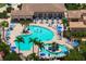 Large pool with plenty of lounge chairs and umbrellas at 8403 Grand Estuary Trl # 106, Bradenton, FL 34212