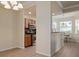 Open dining area with view into kitchen at 8403 Grand Estuary Trl # 106, Bradenton, FL 34212