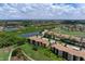 Aerial view of condo community with green spaces at 8403 Grand Estuary Trl # 106, Bradenton, FL 34212