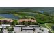 Aerial view showcasing condo community by the water at 8403 Grand Estuary Trl # 106, Bradenton, FL 34212