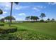 Stunning view of a lush green golf course at 8403 Grand Estuary Trl # 106, Bradenton, FL 34212
