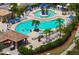 Community pool with plenty of lounge chairs and umbrellas at 8403 Grand Estuary Trl # 106, Bradenton, FL 34212