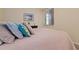 Bright bedroom with a large bed and neutral color scheme at 8403 Grand Estuary Trl # 106, Bradenton, FL 34212