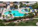 Relaxing resort-style pool with multiple areas for swimming and lounging at 8403 Grand Estuary Trl # 106, Bradenton, FL 34212