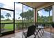 Relaxing screened porch overlooking a lush green space at 8403 Grand Estuary Trl # 106, Bradenton, FL 34212